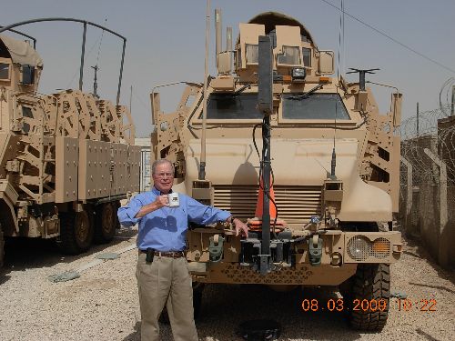 Martin's Tavern Coffee Mug and a U.S. Army mine-resistant armored vehicle.  Samuel Watson. 8-3-09.